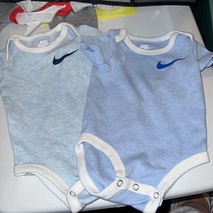 2 nike Onesies shades of blue 9m
